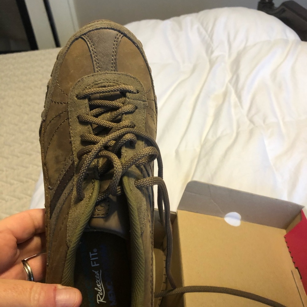 Relaxed fit chocolate Skechers with memory foam .
